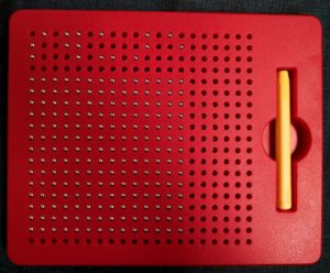 red magnatab tablet and pen with metal balls raised to read "square" in braille with drawing of a square