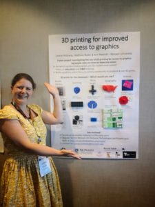 Leona Holloway with poster titled "3D printing for improved access to graphics". 3D prints are attached to the poster.