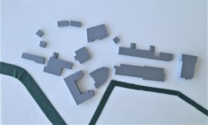 3D printed school buildings and roads on white acrylic base