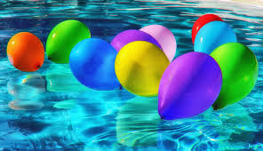 colourful balloons floating in a pool